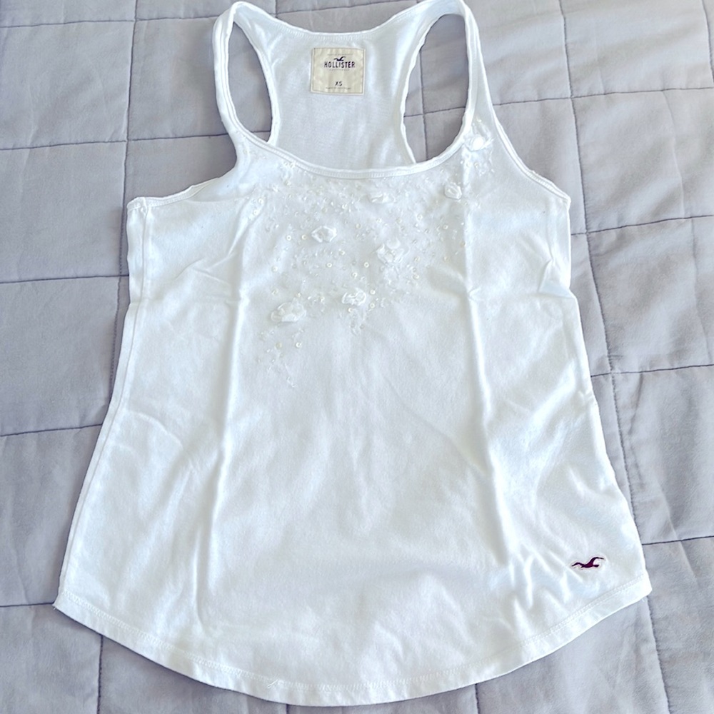 2 tops: White sleeveless top- XS.    Bozzolo Eggplant color bodysuit- Mo